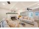 Spacious living room with fireplace, ceiling fans, neutral furniture, and a foosball table at 45 Lyttleton Ave, Charleston, SC 29407