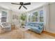 Spacious living room with large windows and a jute area rug at 45 Lyttleton Ave, Charleston, SC 29407