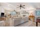 Spacious living room with fireplace, ceiling fans, neutral furniture, and a foosball table at 45 Lyttleton Ave, Charleston, SC 29407