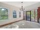 Spacious sunroom with ample natural light, multiple windows, and a view of the yard at 45 Lyttleton Ave, Charleston, SC 29407