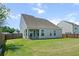 Fenced backyard features a patio with grill and a large lawn area and space to entertain at 514 Morelets Dr, Moncks Corner, SC 29461