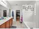 Bathroom with double vanity, soaking tub, and walk-in closet at 514 Morelets Dr, Moncks Corner, SC 29461