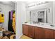 Modern bathroom with double sink vanity, large mirror and sunflower-themed shower curtain, toilet and floor mat at 514 Morelets Dr, Moncks Corner, SC 29461