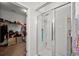 Bathroom with glass enclosed shower and an open walk-in closet at 514 Morelets Dr, Moncks Corner, SC 29461