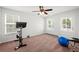 Spacious room perfect for workouts features multiple windows, a ceiling fan and workout equipment at 514 Morelets Dr, Moncks Corner, SC 29461