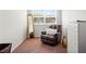 Bright bedroom features a chair with white pillows, a full length gold mirror, and a dresser for storage at 514 Morelets Dr, Moncks Corner, SC 29461