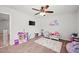 Whimsical bedroom with customized wall decal, toddler bed, and decorative wall mounted television at 514 Morelets Dr, Moncks Corner, SC 29461
