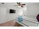Bedroom with modern TV, ceiling fan, and patterned bedspread at 514 Morelets Dr, Moncks Corner, SC 29461