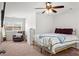 Bright bedroom features a ceiling fan, a bed with stylish bedding and furniture for storage at 514 Morelets Dr, Moncks Corner, SC 29461