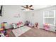 Whimsical bedroom with customized wall decal, decorative toddler bed, and play area at 514 Morelets Dr, Moncks Corner, SC 29461