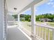 Inviting front porch with white railing offers neighborhood views and is perfect for relaxing at 514 Morelets Dr, Moncks Corner, SC 29461