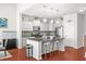 Stylish kitchen featuring granite countertops, stainless appliances, white cabinets, island and bar seating at 514 Morelets Dr, Moncks Corner, SC 29461