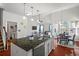 Open kitchen with island, stainless steel appliances and eat-in breakfast nook at 514 Morelets Dr, Moncks Corner, SC 29461
