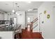 Open concept, showing stairs to the second floor and an eat-in kitchen, wood floors and lots of light at 514 Morelets Dr, Moncks Corner, SC 29461