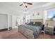 Spacious main bedroom features a ceiling fan, a patterned bedspread, and a walk-in closet at 514 Morelets Dr, Moncks Corner, SC 29461