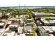 Aerial view of city featuring trees, a parking lot, and architecture with a bridge in the distance at 517 King St # 1, Charleston, SC 29403