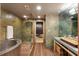 Luxurious bathroom with a glass shower, metal tub, and wooden sink countertop at 517 King St # 1, Charleston, SC 29403