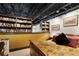 Comfortable bedroom with built-in bookshelves and exposed ductwork ceiling for a unique, industrial-chic look at 517 King St # 1, Charleston, SC 29403