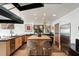 Bright kitchen with updated appliances, a large island, and two bar stools, perfect for entertaining at 517 King St # 1, Charleston, SC 29403