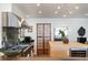 Modern kitchen with stainless steel appliances, granite countertops, and a view to the outside at 517 King St # 1, Charleston, SC 29403
