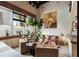 Inviting living room featuring large windows, a comfortable sofa, hardwood floors, and stylish decor at 517 King St # 1, Charleston, SC 29403