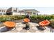 Charming rooftop deck featuring inviting orange chairs, potted plants, and ample seating at 517 King St # 1, Charleston, SC 29403
