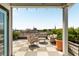 Relax on this rooftop deck featuring comfortable seating, beautiful city views and green plants at 517 King St # 1, Charleston, SC 29403