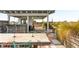 Spacious rooftop patio with a dining table for outdoor gatherings and lush green grass at 517 King St # 1, Charleston, SC 29403