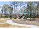 Community playground with mature trees and surrounding seating at 547 Nelliefield Trl, Wando, SC 29492