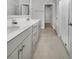 Well-lit bathroom featuring double sinks, ample counter space, and a modern glass-enclosed shower at 572 Dunswell Dr, Summerville, SC 29486