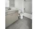 Bathroom featuring a vanity with gray cabinets, light countertops, and a tub shower combo at 572 Dunswell Dr, Summerville, SC 29486