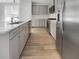 Modern kitchen featuring stainless steel appliances, bright counters, and a central island for food preparation and entertaining at 572 Dunswell Dr, Summerville, SC 29486