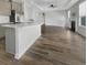 Spacious living room featuring an island, fireplace, ceiling fan, and hardwood floors at 572 Dunswell Dr, Summerville, SC 29486