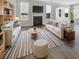 Bright and airy living room featuring stylish furnishings, a fireplace, and ample natural light at 572 Dunswell Dr, Summerville, SC 29486