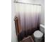 Cozy bathroom featuring a shower with a patterned curtain and a classic toilet at 613 Ravens Wood Rd, Summerville, SC 29486