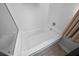 Clean white bathtub with integrated shower plumbing and tile surround at 613 Ravens Wood Rd, Summerville, SC 29486
