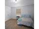 Carpeted bedroom with a large window, simple furnishings, and plenty of natural light at 613 Ravens Wood Rd, Summerville, SC 29486
