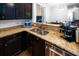 The kitchen features granite countertops, a stainless steel sink, modern appliances, and ample cabinet space at 613 Ravens Wood Rd, Summerville, SC 29486
