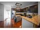 Bright kitchen with stainless steel appliances, granite countertops, and an island at 613 Ravens Wood Rd, Summerville, SC 29486