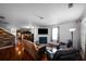 Bright living room featuring hardwood floors, a fireplace, and comfortable seating arrangements at 613 Ravens Wood Rd, Summerville, SC 29486