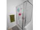 Shower with clear glass enclosure, shower head and tiled floor at 613 Ravens Wood Rd, Summerville, SC 29486