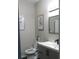 Neutral powder room featuring gray vanity, black faucet, wall art and elongated toilet seat at 8800 Dorchester Rd # 2902, North Charleston, SC 29420