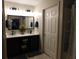 Bathroom features double vanity, large mirrors, and modern lighting at 8800 Dorchester Rd # 2902, North Charleston, SC 29420