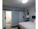 Bedroom includes ensuite bathroom with modern sliding barn door at 8800 Dorchester Rd # 2902, North Charleston, SC 29420
