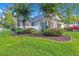 Charming two-story home featuring manicured landscaping, mature trees and inviting curb appeal at 8800 Dorchester Rd # 2902, North Charleston, SC 29420