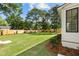 Spacious backyard showcasing a well-maintained lawn and a newly installed wood fence at 924 Trowman Ln, Mount Pleasant, SC 29464