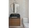 Elegant half-bath with designer floral wallpaper, wood vanity, marble countertop and brass hardware at 924 Trowman Ln, Mount Pleasant, SC 29464