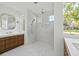 Bathroom featuring double vanity with marble countertop, wooden cabinets, and luxurious marble shower at 924 Trowman Ln, Mount Pleasant, SC 29464