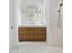 Bathroom featuring a vanity with marble countertop, wooden cabinets, and a stylish mirror at 924 Trowman Ln, Mount Pleasant, SC 29464