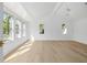 Large bedroom with hardwood flooring, a vaulted ceiling, and plenty of natural light from multiple windows at 924 Trowman Ln, Mount Pleasant, SC 29464